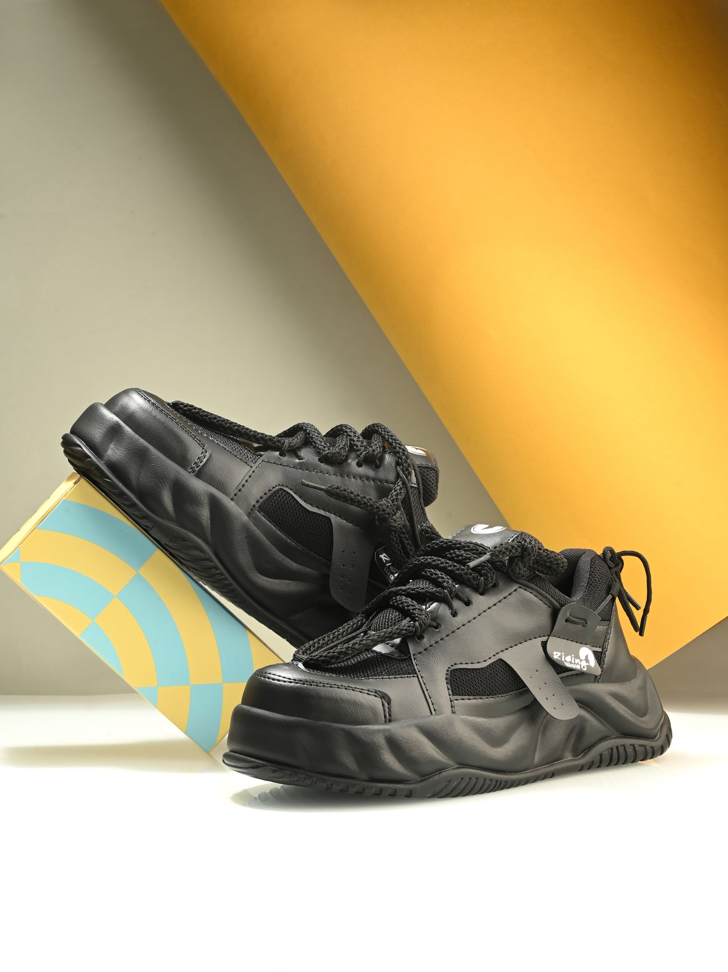 Men’s black chunky sneakers with thick sole and lace-up design