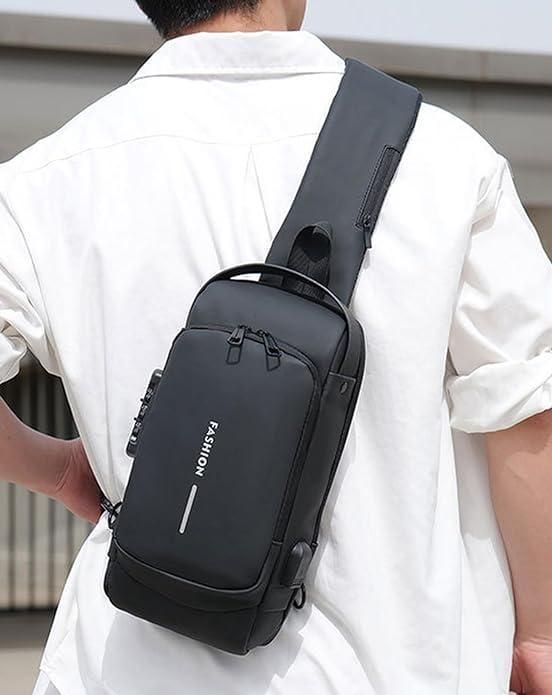 Man wearing a black sling bag with zipper pockets and adjustable strap over a white shirt