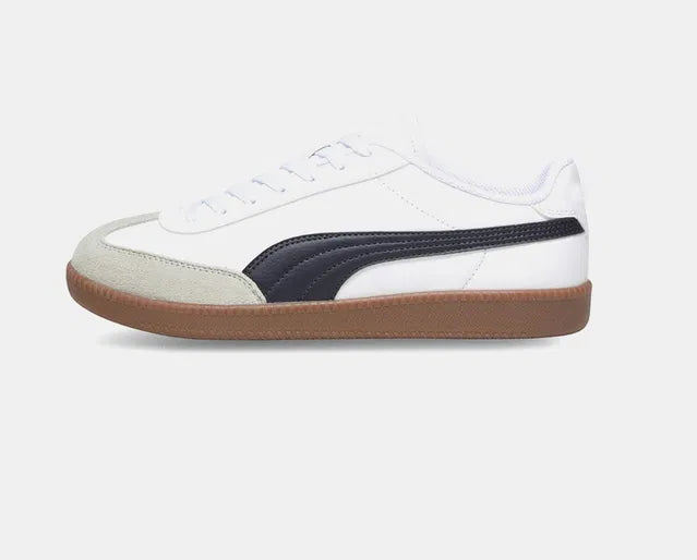 white men's sneaker featuring a signature black side stripe, a grey suede T-toe overlay, and a vintage-style gum rubber sole.