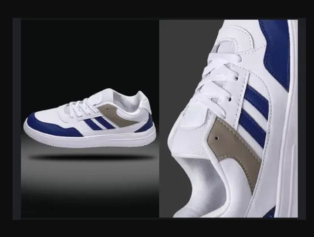 Premium men’s white sneaker featuring bold navy blue stripes and a khaki tan accent panel, highlighting the clean stitching and durable white mid sole.