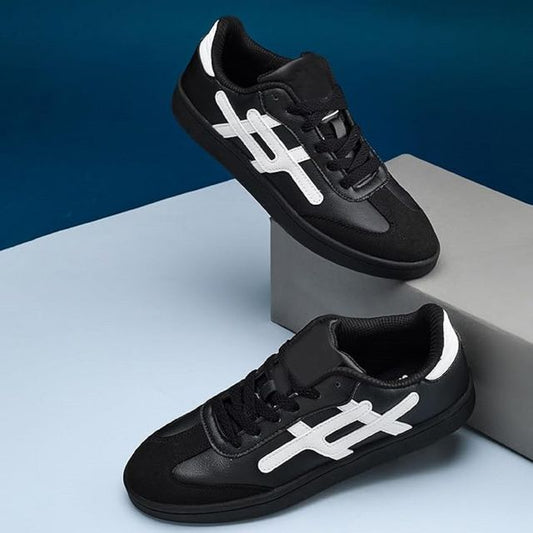 black leather sneakers with black suede toe caps, white side branding, and solid black out soles.