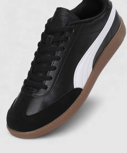 Black leather sneakers with a white side stripe, a black suede toe cap, and a classic gum rubber out sole.