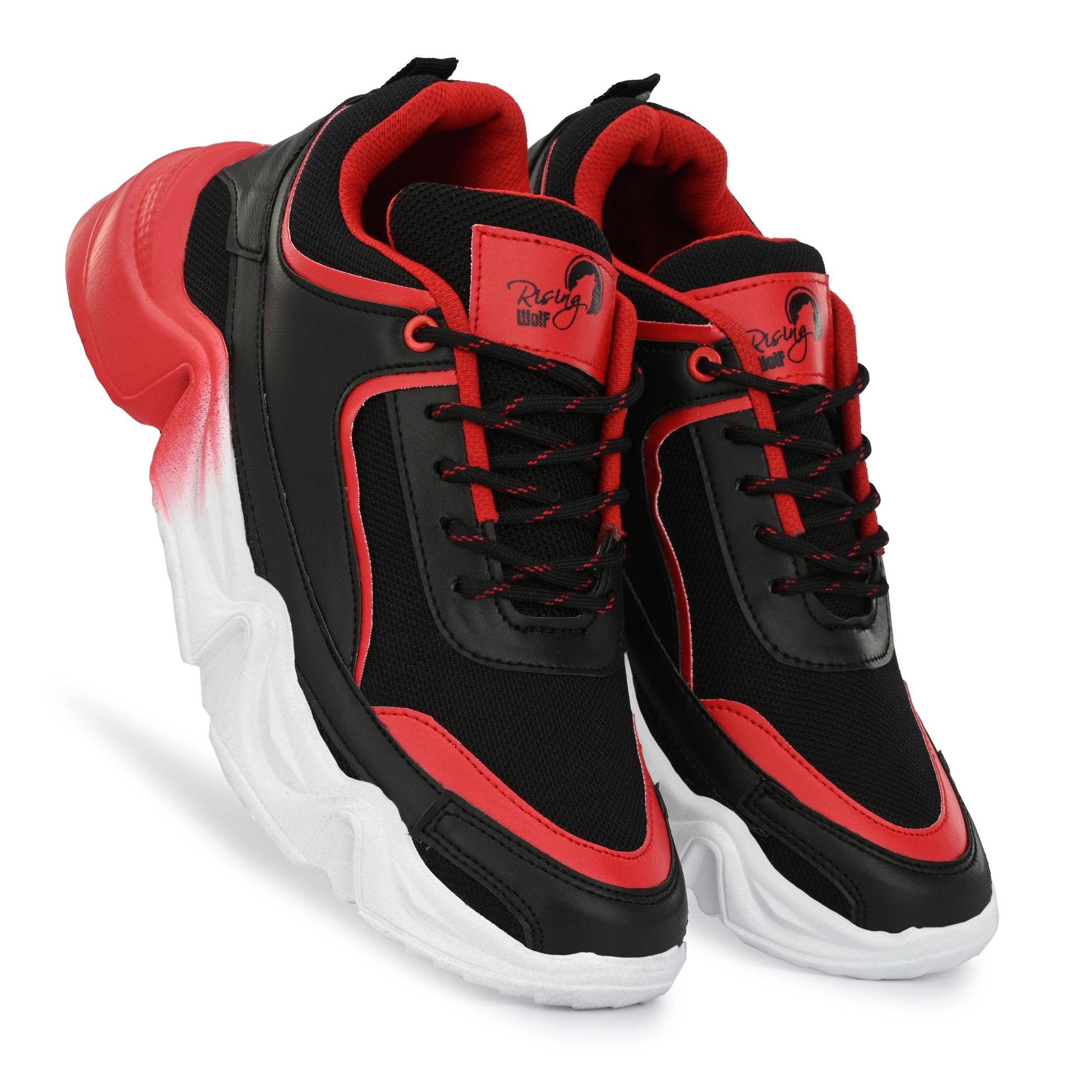 Rising Wolf men's chunky sneakers in black and red with a thick white wavy sole, styled with green joggers on a paved walk.