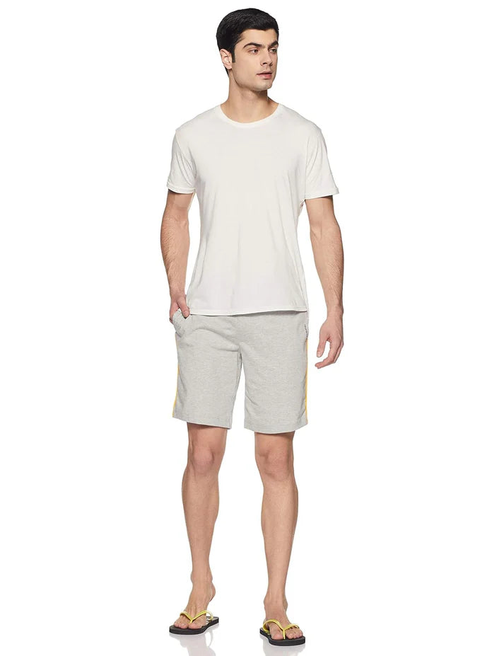 Man wearing light grey stretchable cotton shorts and a white t-shirt, front view