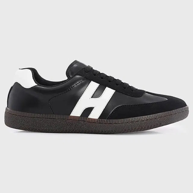 black and white men's casual sneakers with a textured gum sole and a bold white 'H' logo on the side