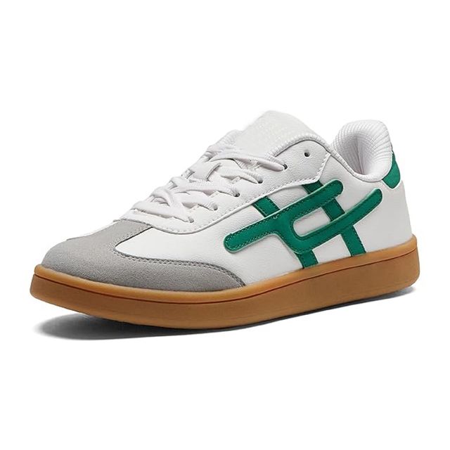 white leather sneakers with grey suede toe caps, emerald green side branding, and tan gum rubber soles