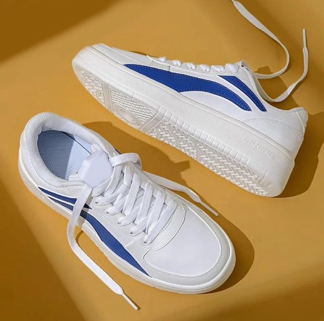 men's white chunky sneakers with blue side stripes and white laces