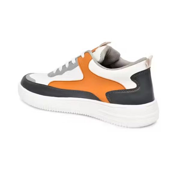 Men's multi-colour sneakers featuring white, tan, and grey patchwork panels with a thick white textured 'AIR' sole and white laces