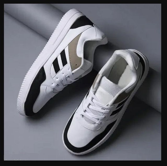 men's white fashion sneakers featuring bold black stripes and a tan heel accent, designed with a thick white mid sole and white laces for a modern casual look.