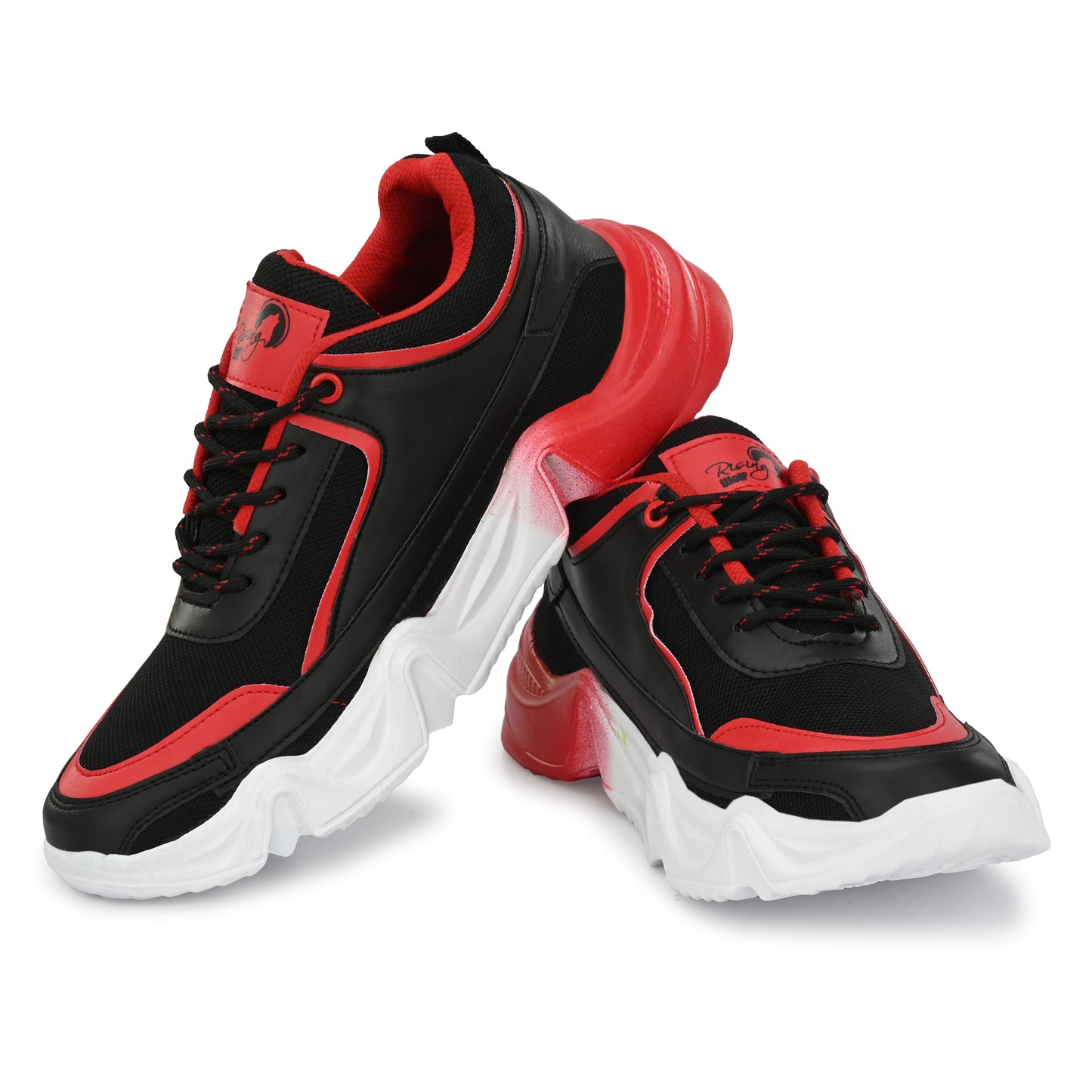 Rising Wolf men's chunky sneakers in black and red with a thick white wavy sole, styled with green joggers on a paved walk.