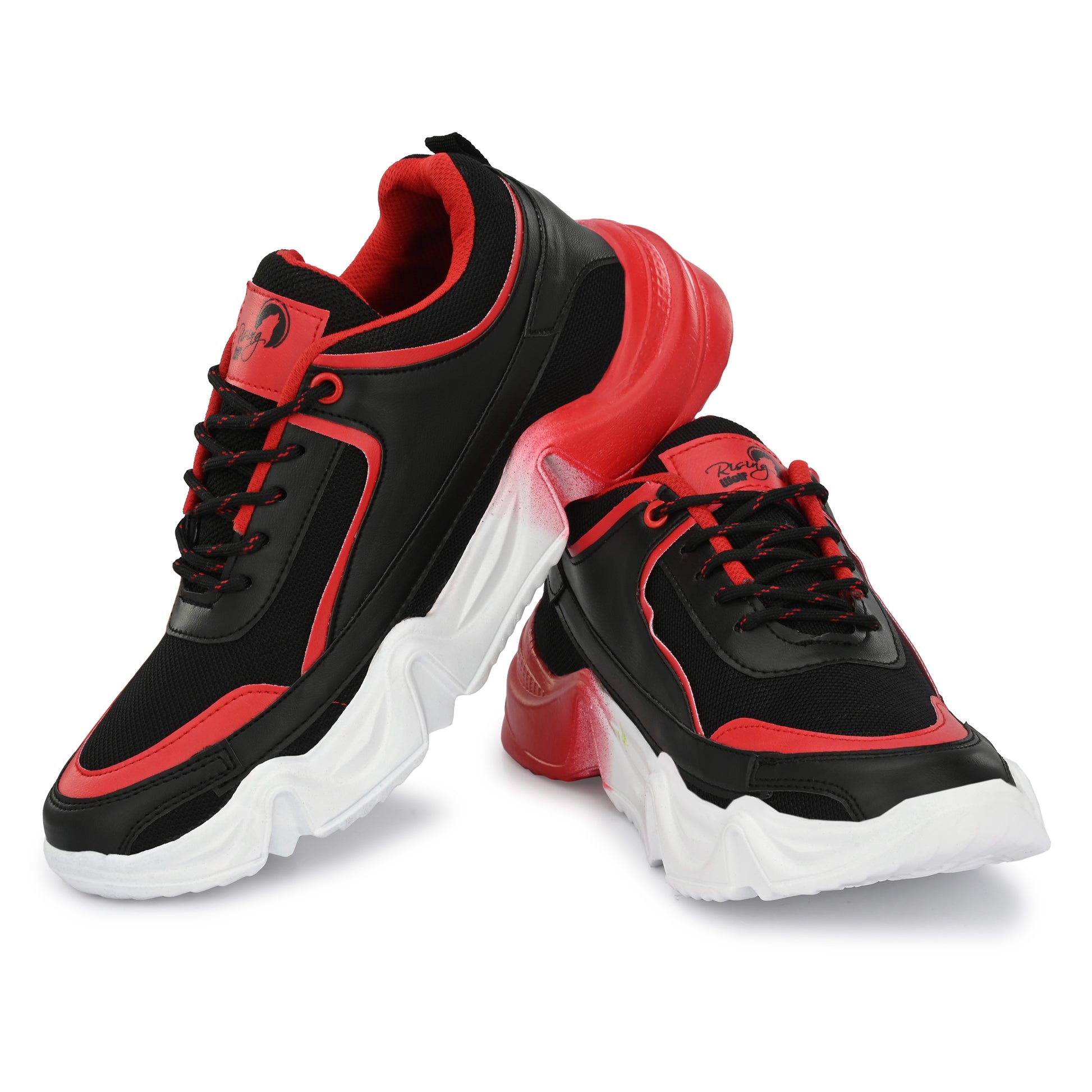 Rising Wolf men's chunky sneakers in black and red with a thick white wavy sole, styled with green joggers on a paved walk.