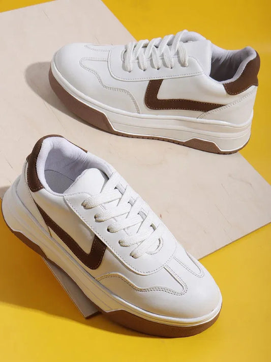 premium white men's lifestyle sneakers with tan brown accents, thick platform soles.