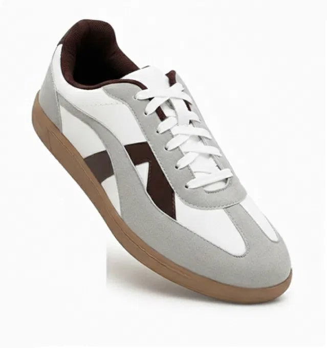 White leather sneakers with grey suede overlays, brown side stripes, and a dark brown gum rubber sole