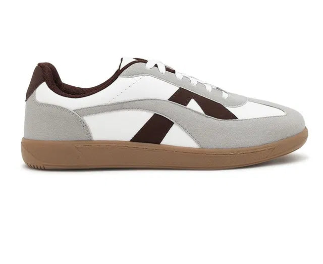 White leather sneakers with grey suede overlays, brown side stripes, and a dark brown gum rubber sole